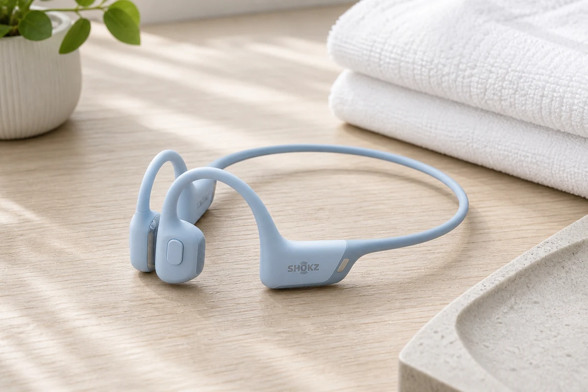 Shokz OpenRun Pro 2 open-ear running headphones on a bright desk
