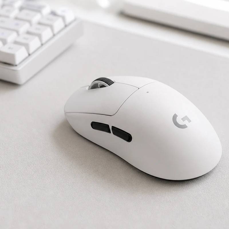 Logitech G Pro X Superlight 2 wireless gaming mouse in a bright desk setup